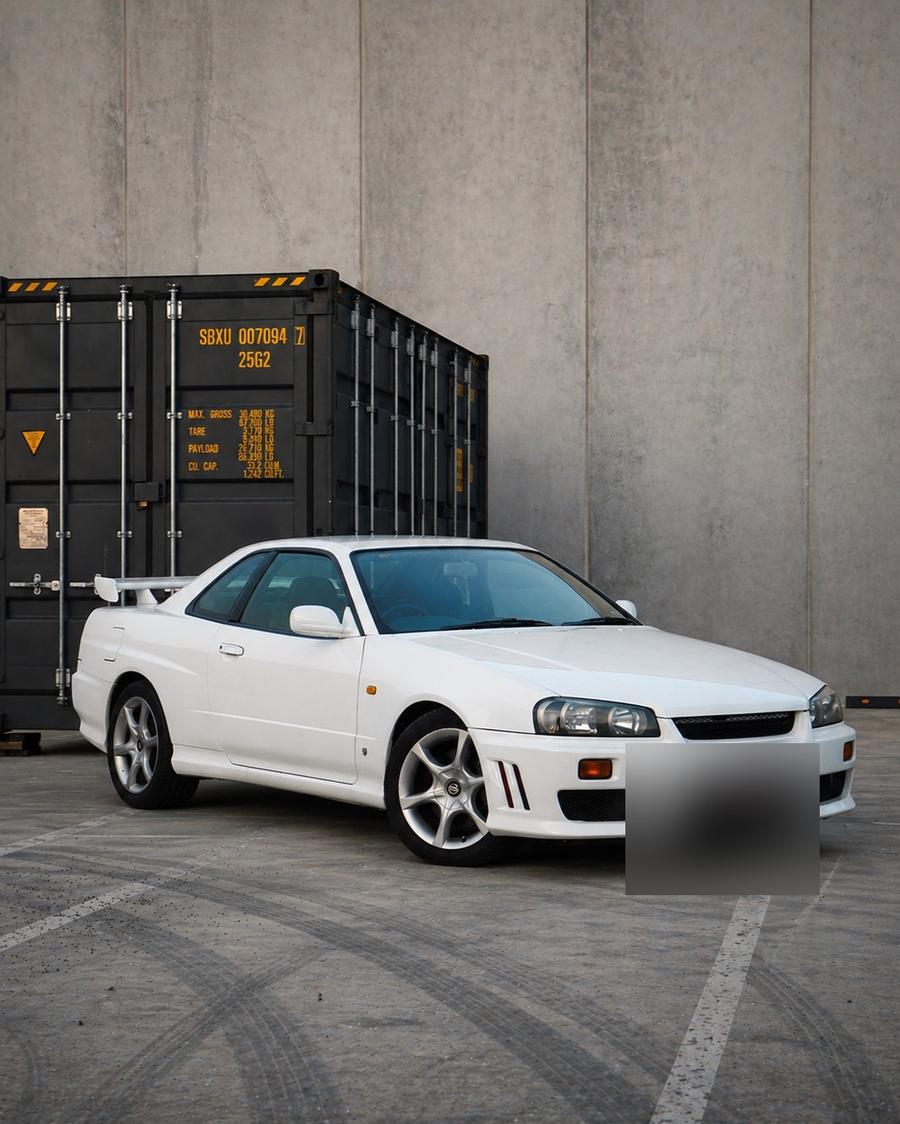 Nissan Skyline R34 GT-T registered under a Fukasawa Car Imports Club permit, number plate blurred