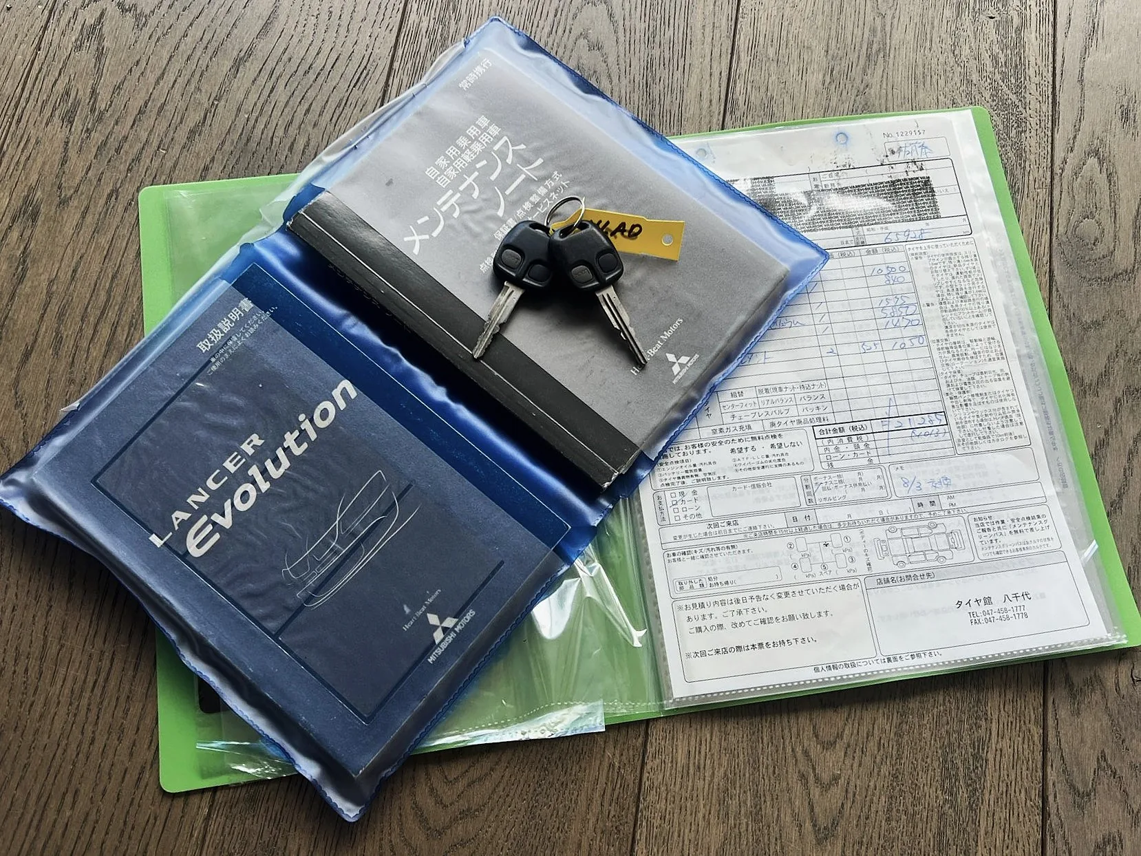 Original Japanese maintenance booklet, keys, and service record for an imported Evolution VIII GSR