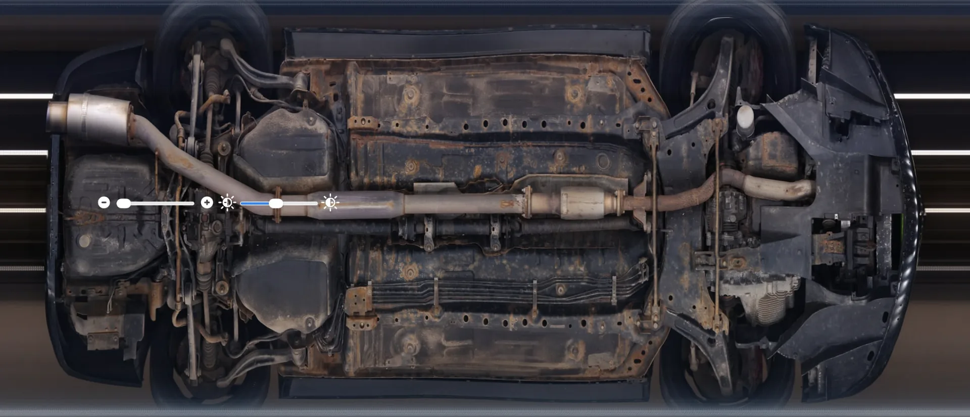 Underbody scan of a Mitsubishi Evolution VIII showing surface rust and corrosion across the frame rails and subframe